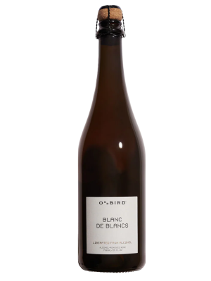 A dark glass bottle of Oddbird Sparkling Blanc de Blanc NV non-alcoholic sparkling wine with a cork and a white label on the front.